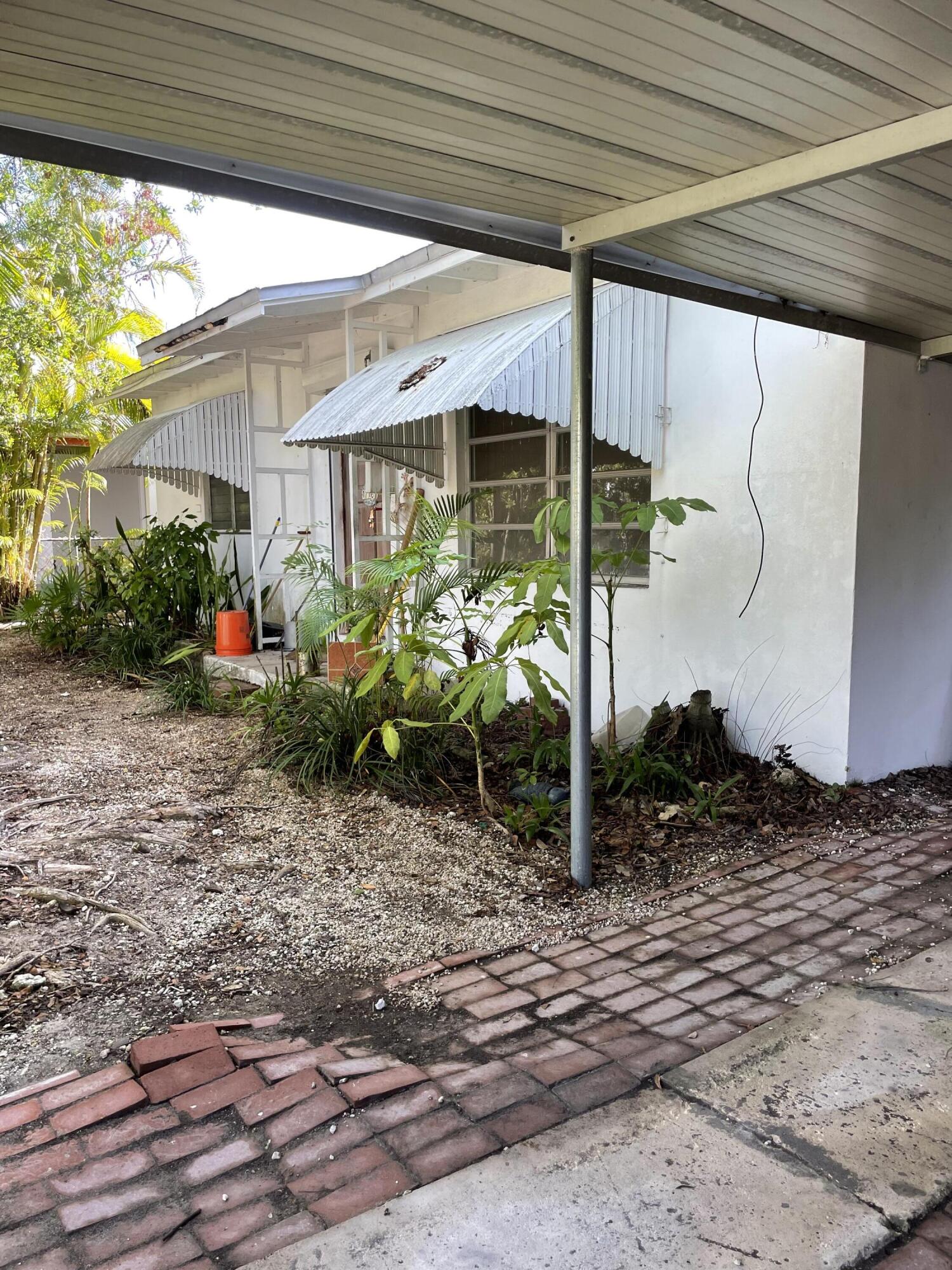 1716 Laird Street Key West, FL 33040 - Photo 30 of 32 a front view of a house with plants