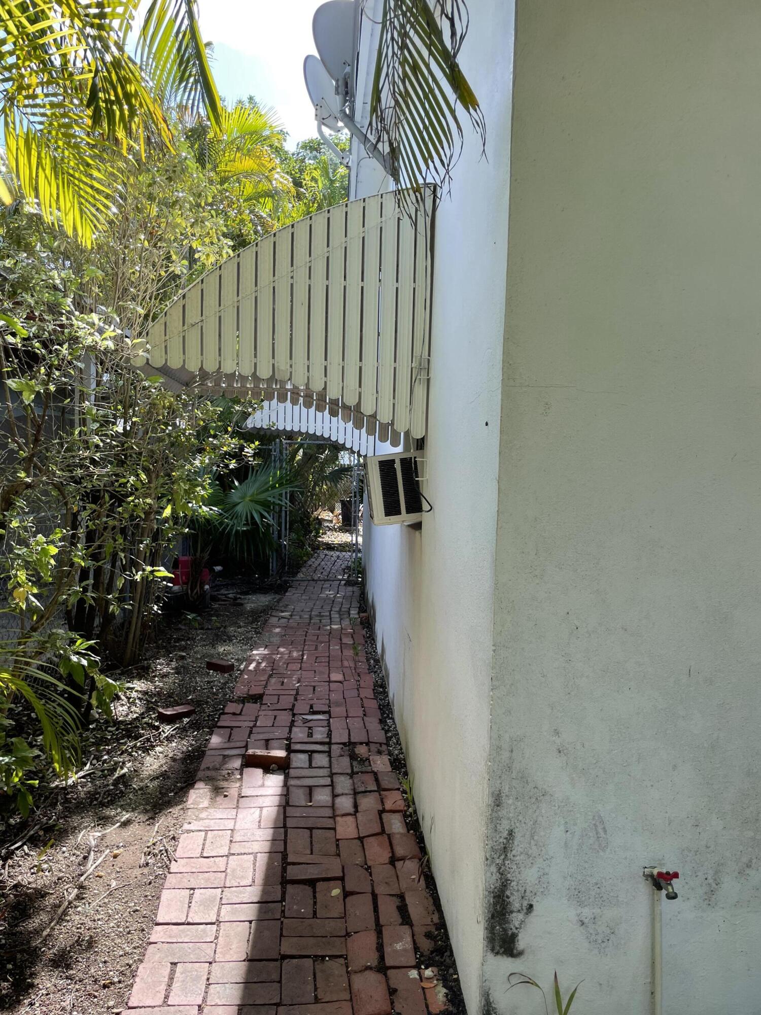 1716 Laird Street Key West, FL 33040 - Photo 32 of 32 a view of a backyard with pathway