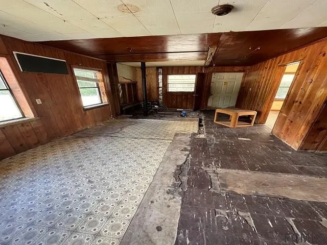 a view of a room with wooden floor