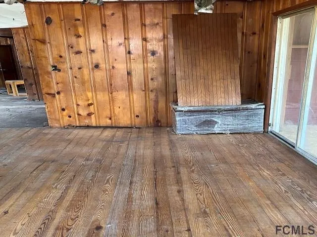 a view of wooden floor and closet