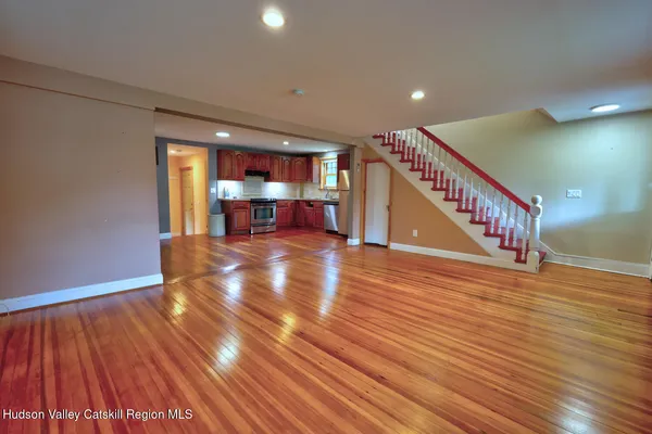 a view of a room with wooden floor