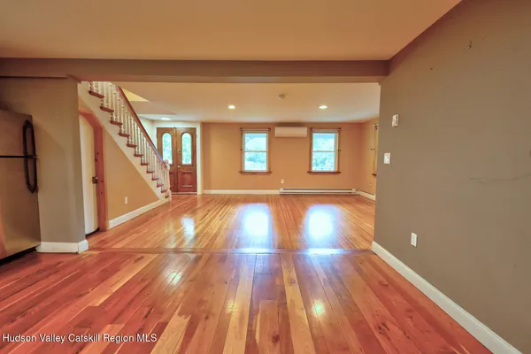 a view of entryway with wooden floor