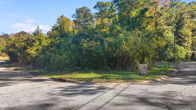 a view of a backyard with swimming pool