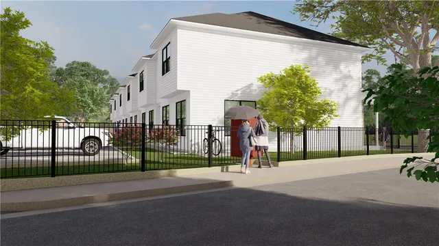 a view of street along with house and trees