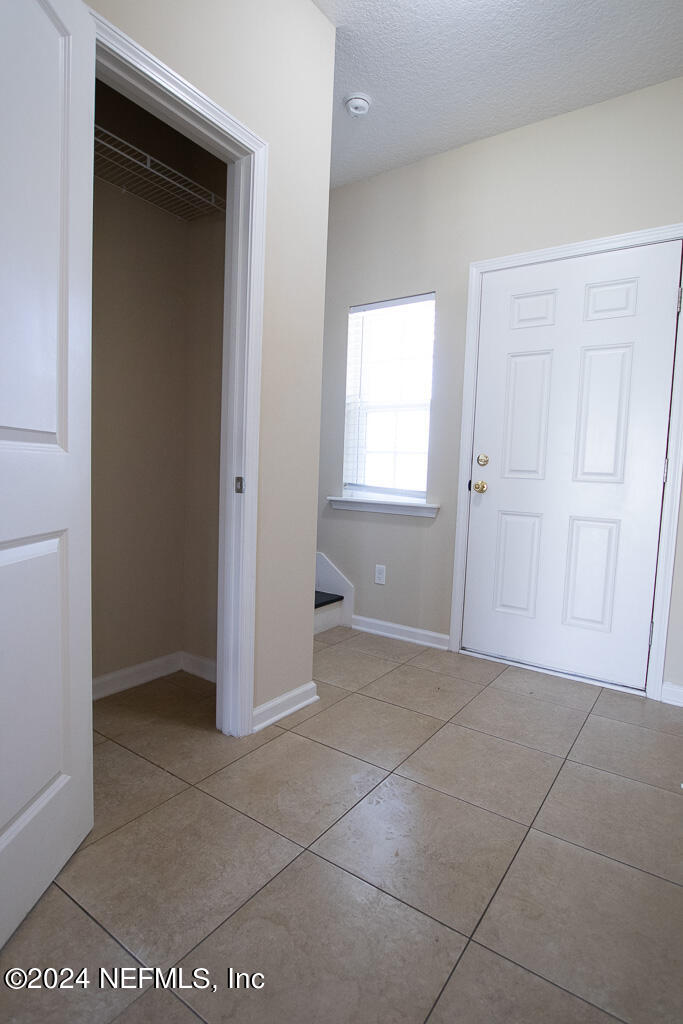 3107 Chestnut Ridge Way Orange Park, FL 32065 - Photo 7 of 22 an empty room with windows and closet