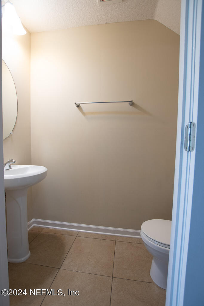 3107 Chestnut Ridge Way Orange Park, FL 32065 - Photo 8 of 22 a bathroom with a sink and a toilet