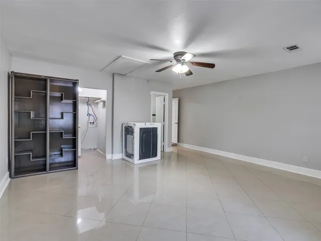 a bathroom with a shower a toilet and sink