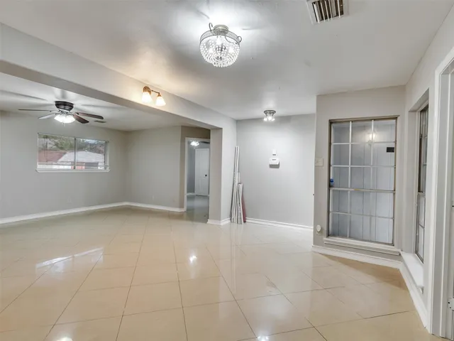 a view of an empty room and window