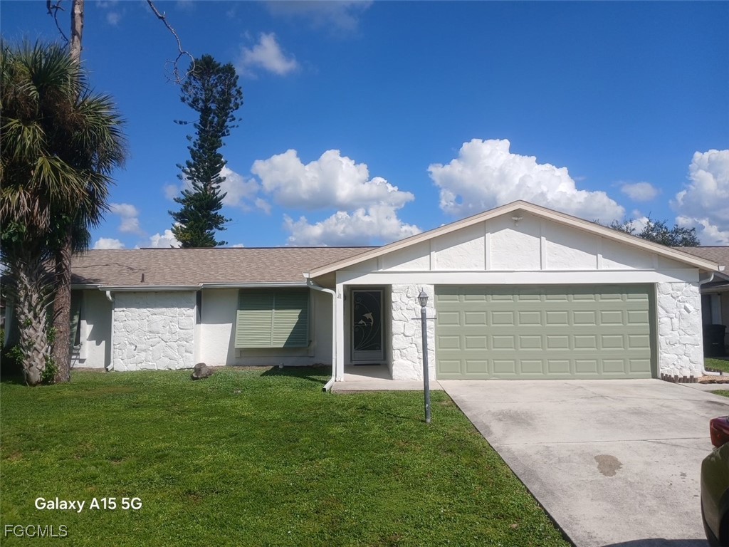 16268 Shadow Pine Road North Fort Myers, FL 33917 - Photo 1 of 25 a front view of house with yard