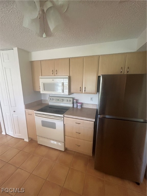 16268 Shadow Pine Road North Fort Myers, FL 33917 - Photo 19 of 25 a kitchen with white cabinets and white appliances