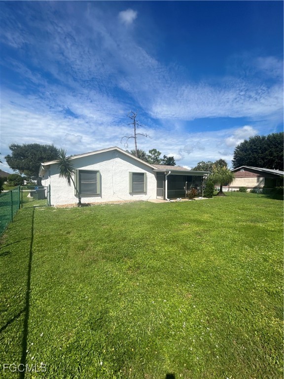 16268 Shadow Pine Road North Fort Myers, FL 33917 - Photo 23 of 25 a front view of a house with a yard