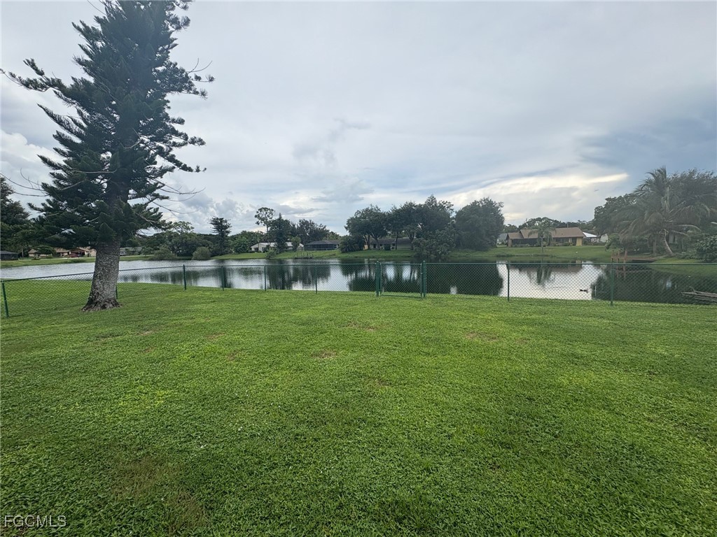 16268 Shadow Pine Road North Fort Myers, FL 33917 - Photo 3 of 25 a backyard of a house with lots of green space and lake view