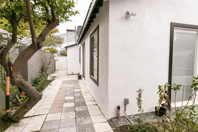 a view of a pathway both side of house