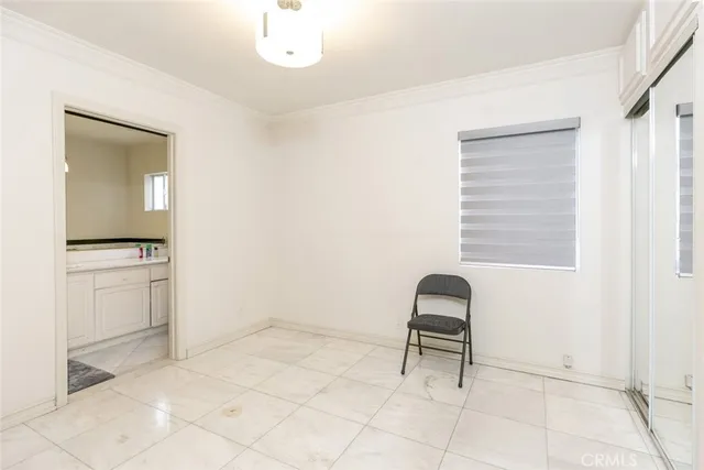 a room with a chair and a mirror