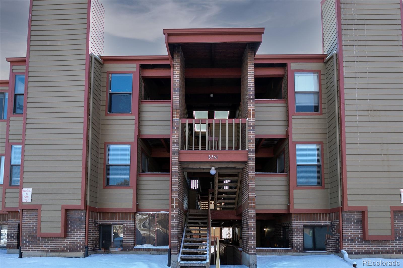 8741 Dawson Street, Unit 304 Denver, CO 80229 - Photo 1 of 27 a front view of a house with glass windows