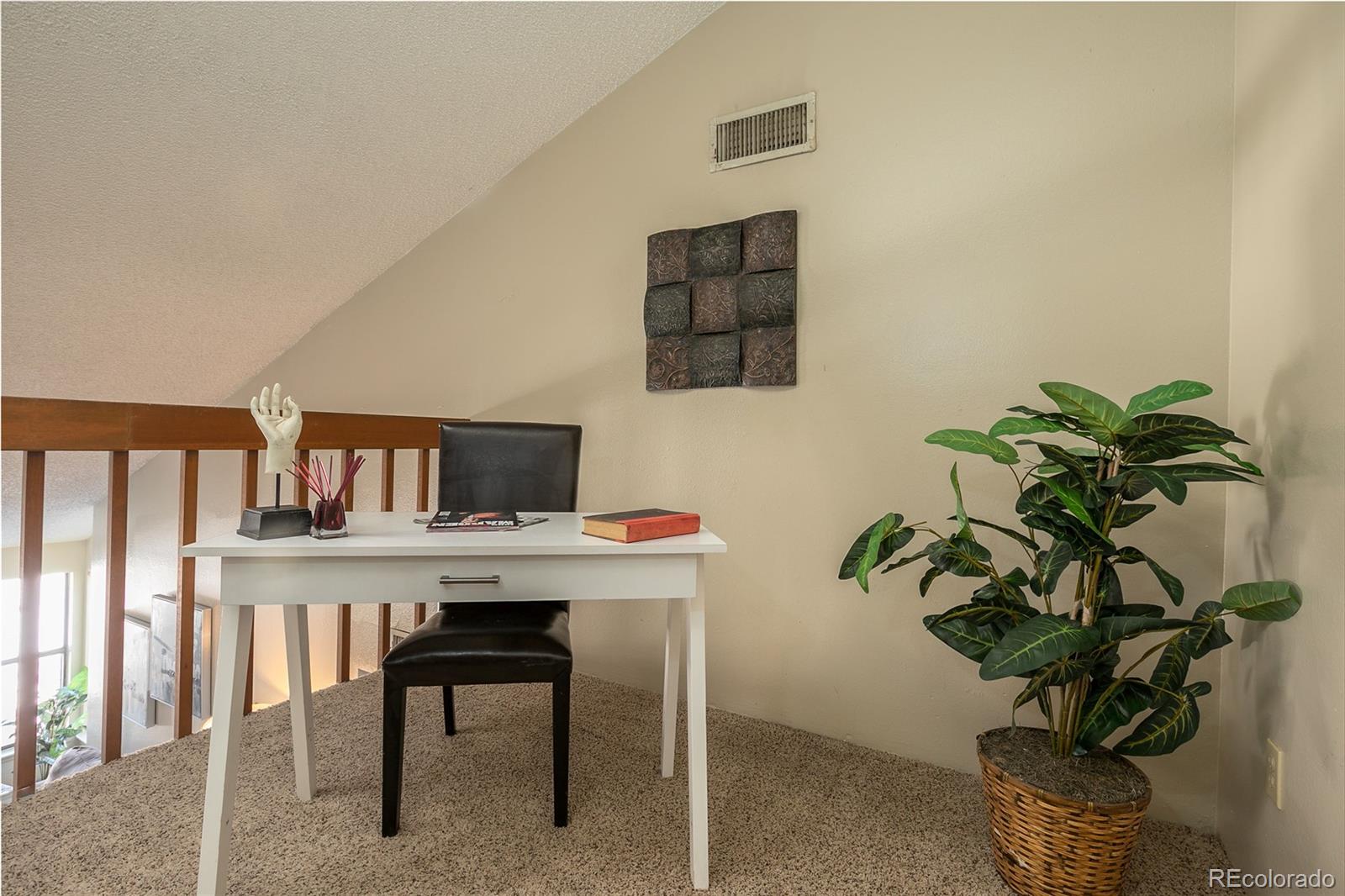 8741 Dawson Street, Unit 304 Denver, CO 80229 - Photo 13 of 27 a view of a workspace with furniture