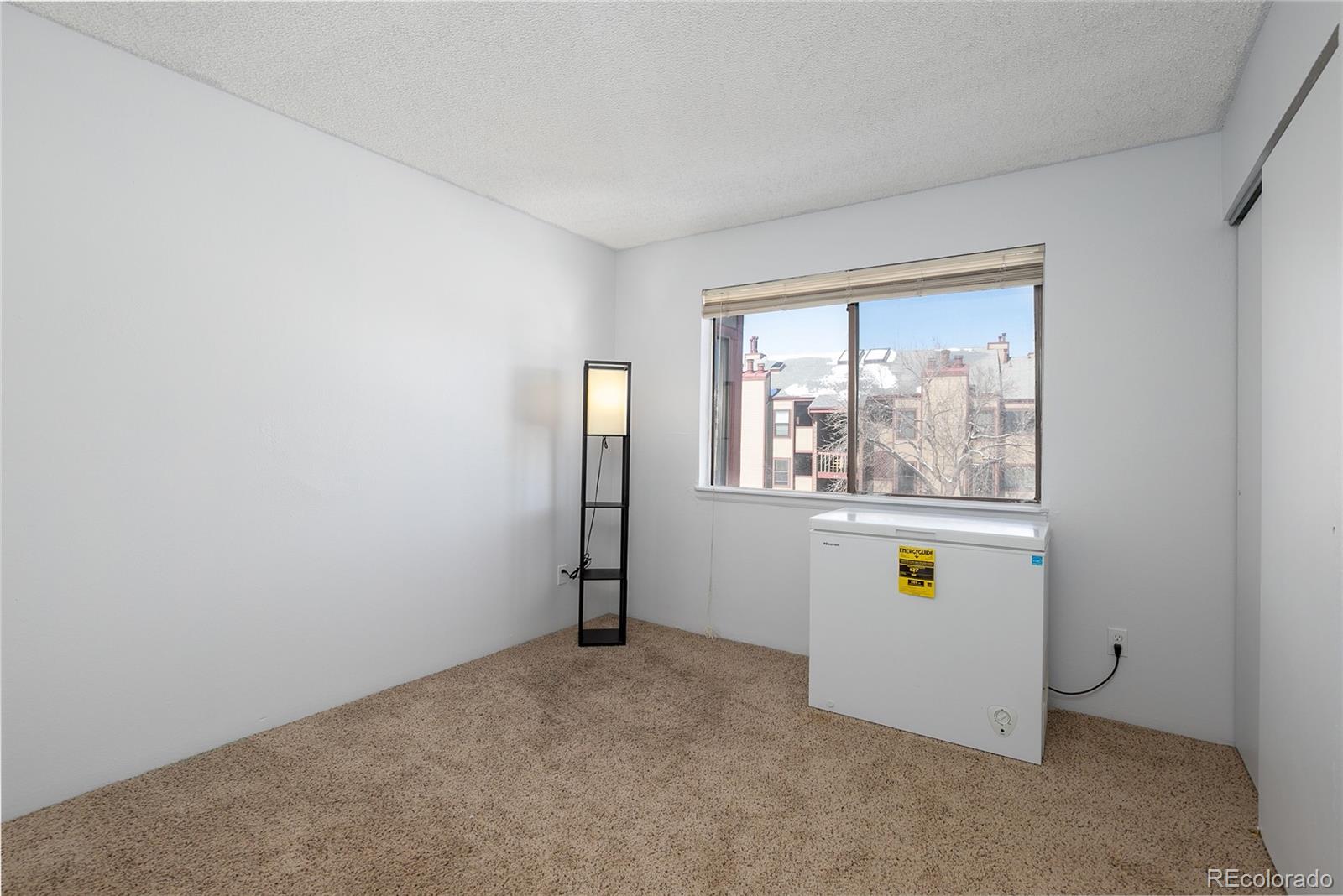 8741 Dawson Street, Unit 304 Denver, CO 80229 - Photo 21 of 27 an empty room with windows