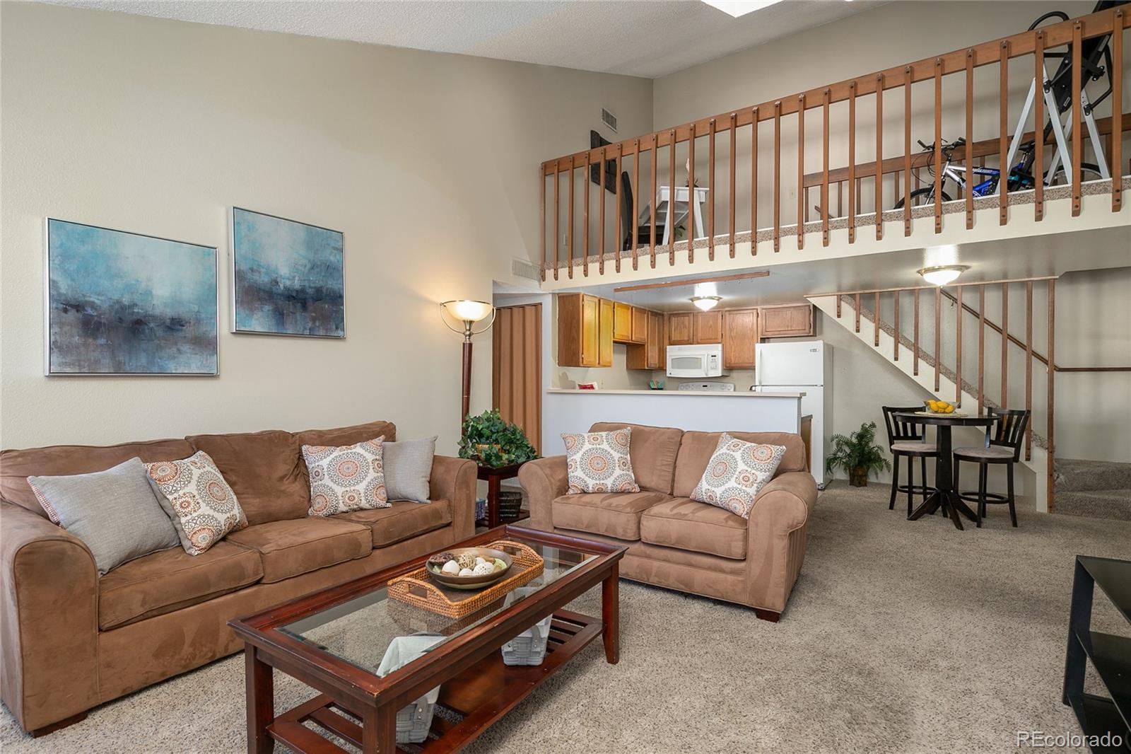 8741 Dawson Street, Unit 304 Denver, CO 80229 - Photo 7 of 27 a living room with furniture and a flat screen tv