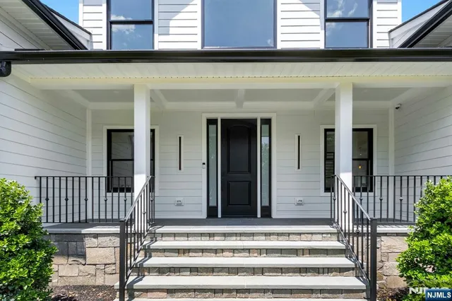 a front view of a house with a porch