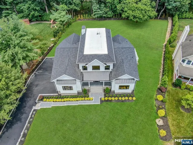 an aerial view of a house with a garden