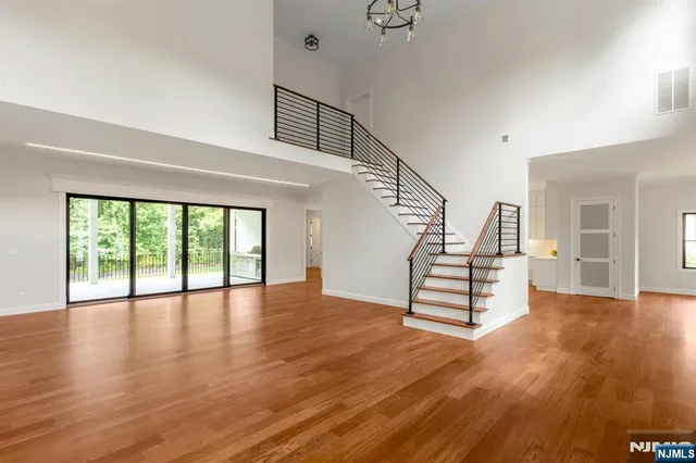 a view of an entryway with wooden floor