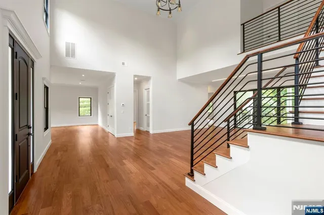 a view of an entryway with wooden floor