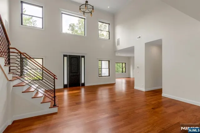 a view of an entryway with wooden floor