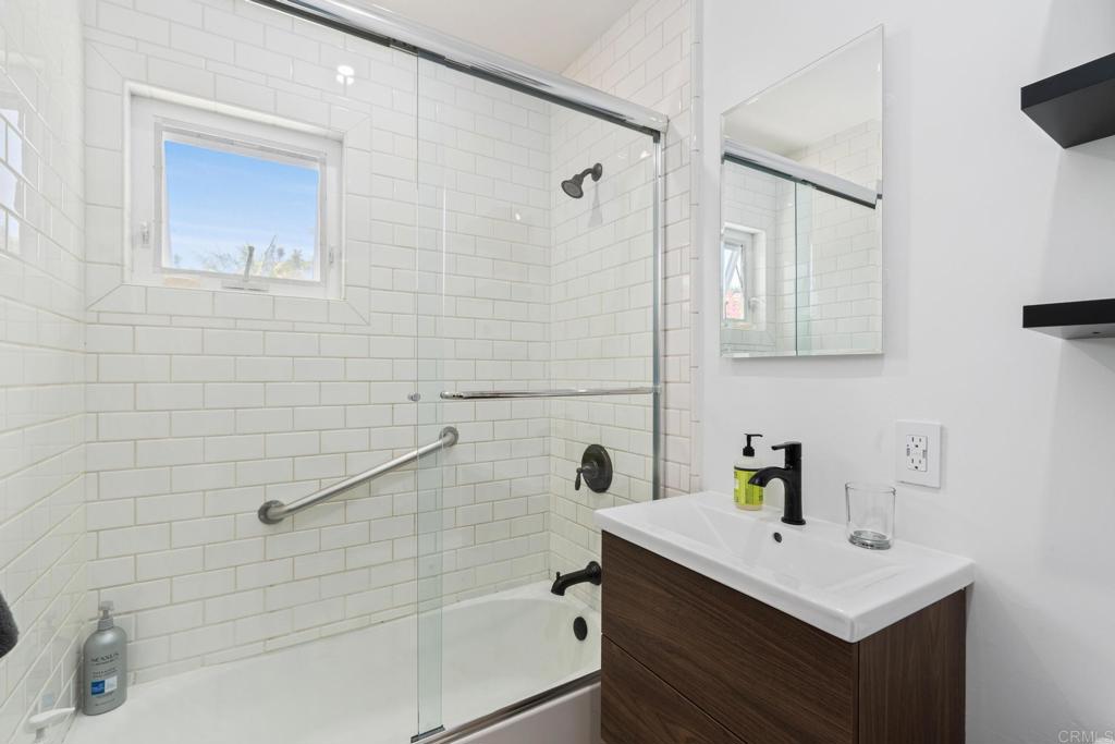219 24th Street Del Mar, CA 92014 - Photo 12 of 15 a bathroom with a sink and mirror