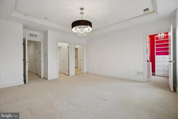 a bedroom with a bed and a lamp