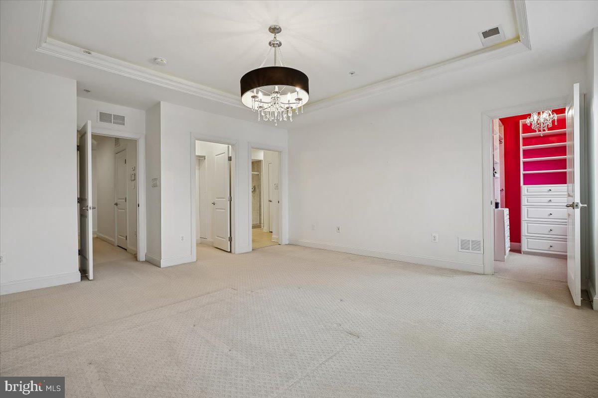 452 Exchange Avenue Gaithersburg, MD 20878 - Photo 11 of 37 an empty room with a fan and a large window