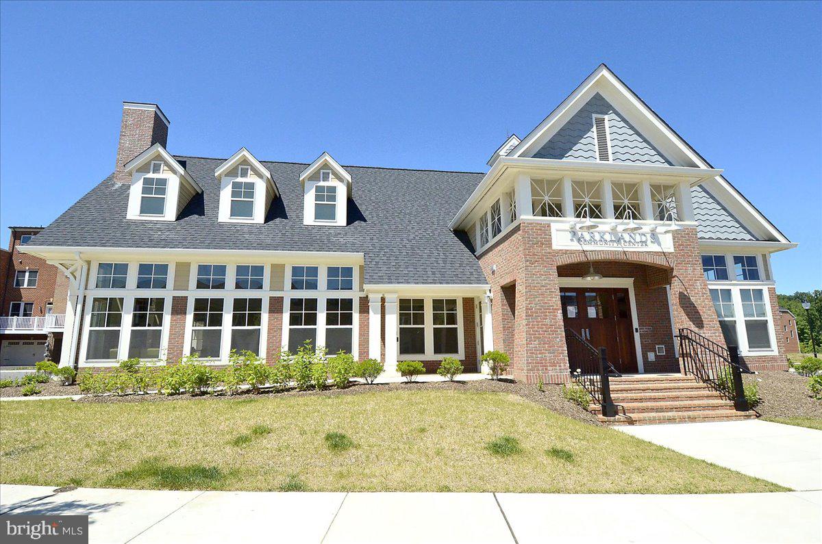 452 Exchange Avenue Gaithersburg, MD 20878 - Photo 19 of 37 a front view of a house with a yard