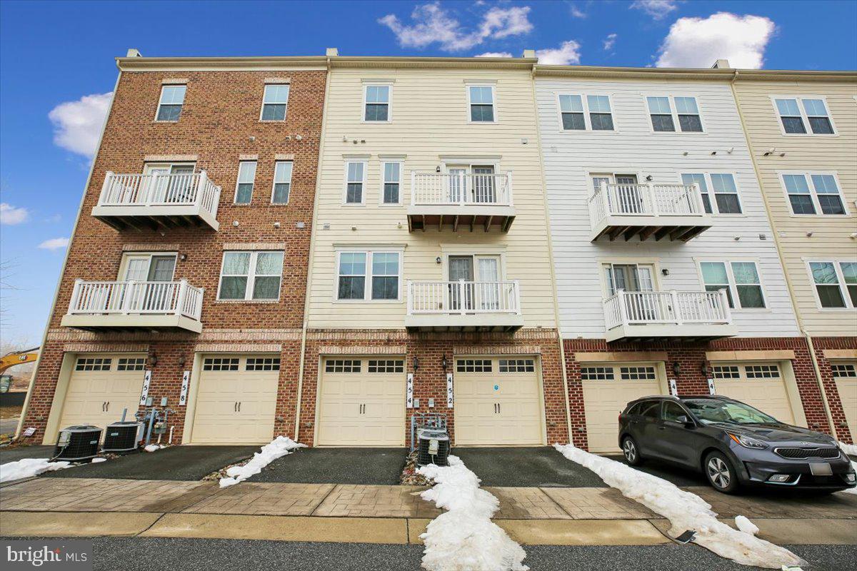 452 Exchange Avenue Gaithersburg, MD 20878 - Photo 2 of 37 a front view of a building with multiple windows