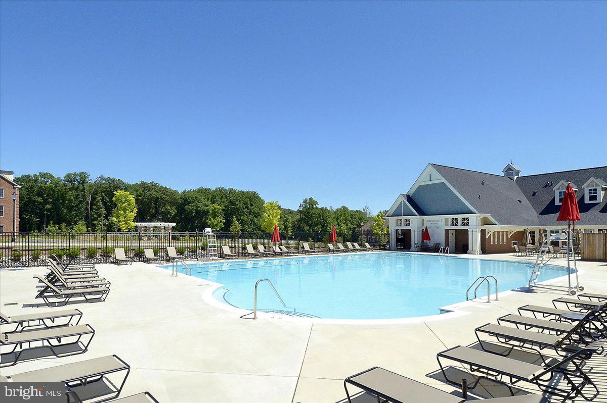 452 Exchange Avenue Gaithersburg, MD 20878 - Photo 24 of 37 a view of a swimming pool and lounge chairs
