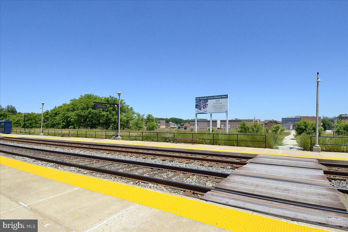 452 Exchange Avenue Gaithersburg, MD 20878 - Photo 33 of 37 a view of a swimming pool with a table and chairs