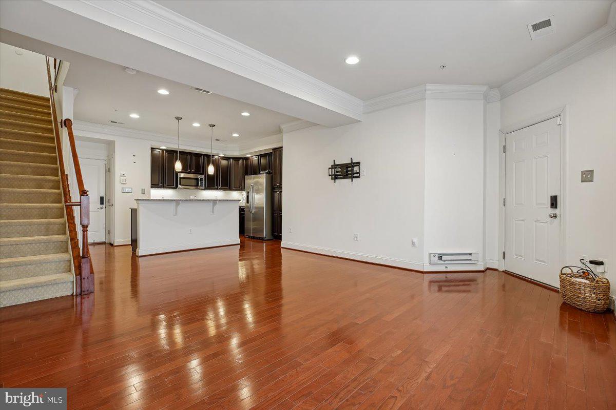 452 Exchange Avenue Gaithersburg, MD 20878 - Photo 5 of 37 a view of open kitchen with wooden floor and electronic appliances