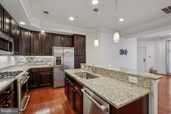 a bathroom with a sink a mirror and a shower