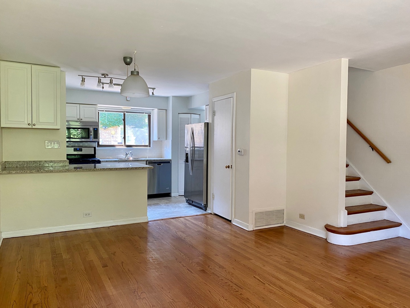 511 Ridge Road, Unit 511 Wilmette, IL 60091 - Photo 8 of 14 a view of a kitchen with wooden floor and electronic appliances