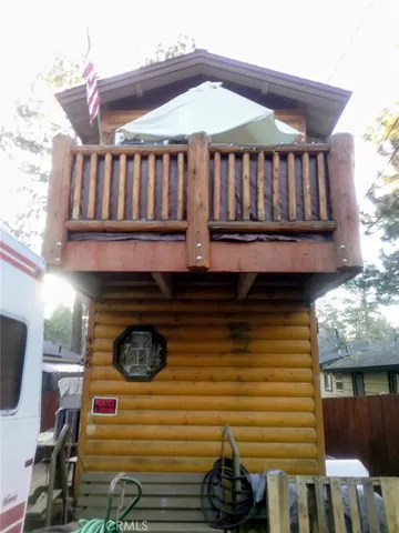 a front view of a house with entryway and wooden floor