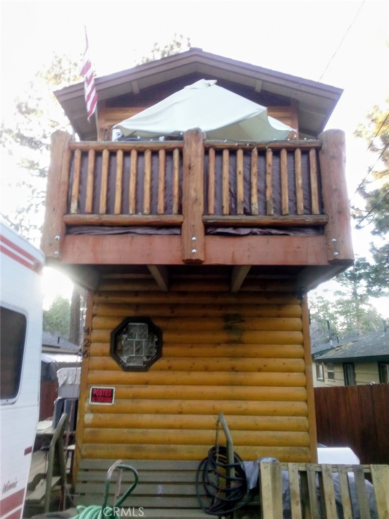 a front view of a house with entryway and wooden floor
