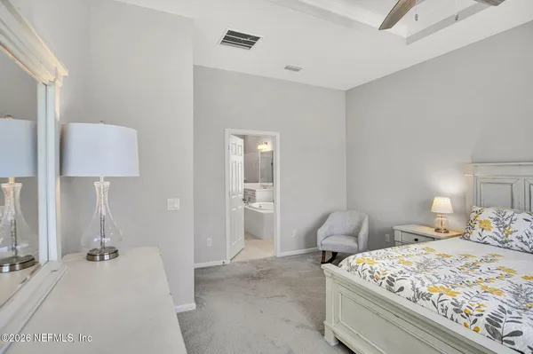 a bathroom with a granite countertop sink a toilet and a bathtub