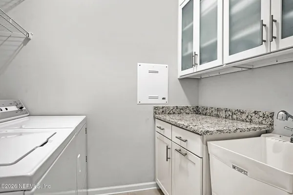 an aerial view of a house with a swimming pool