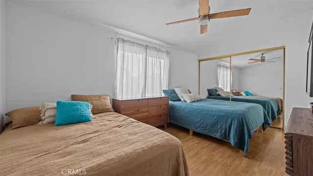 a bedroom with bed and window