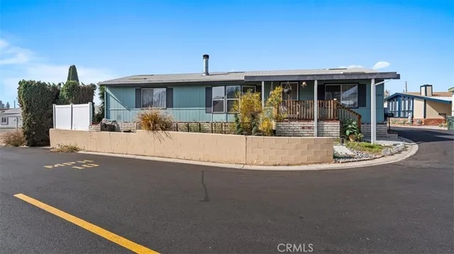 a view of a house with swimming pool and sitting area