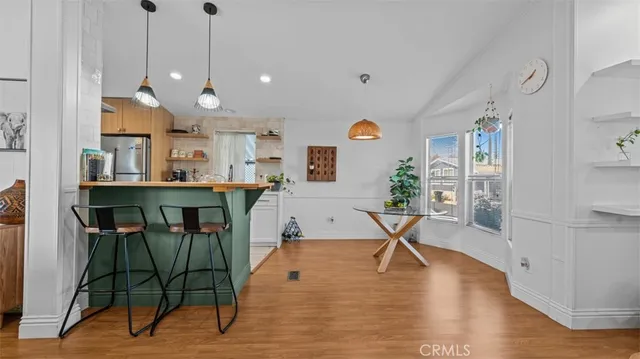 a view of a kitchen and dining room
