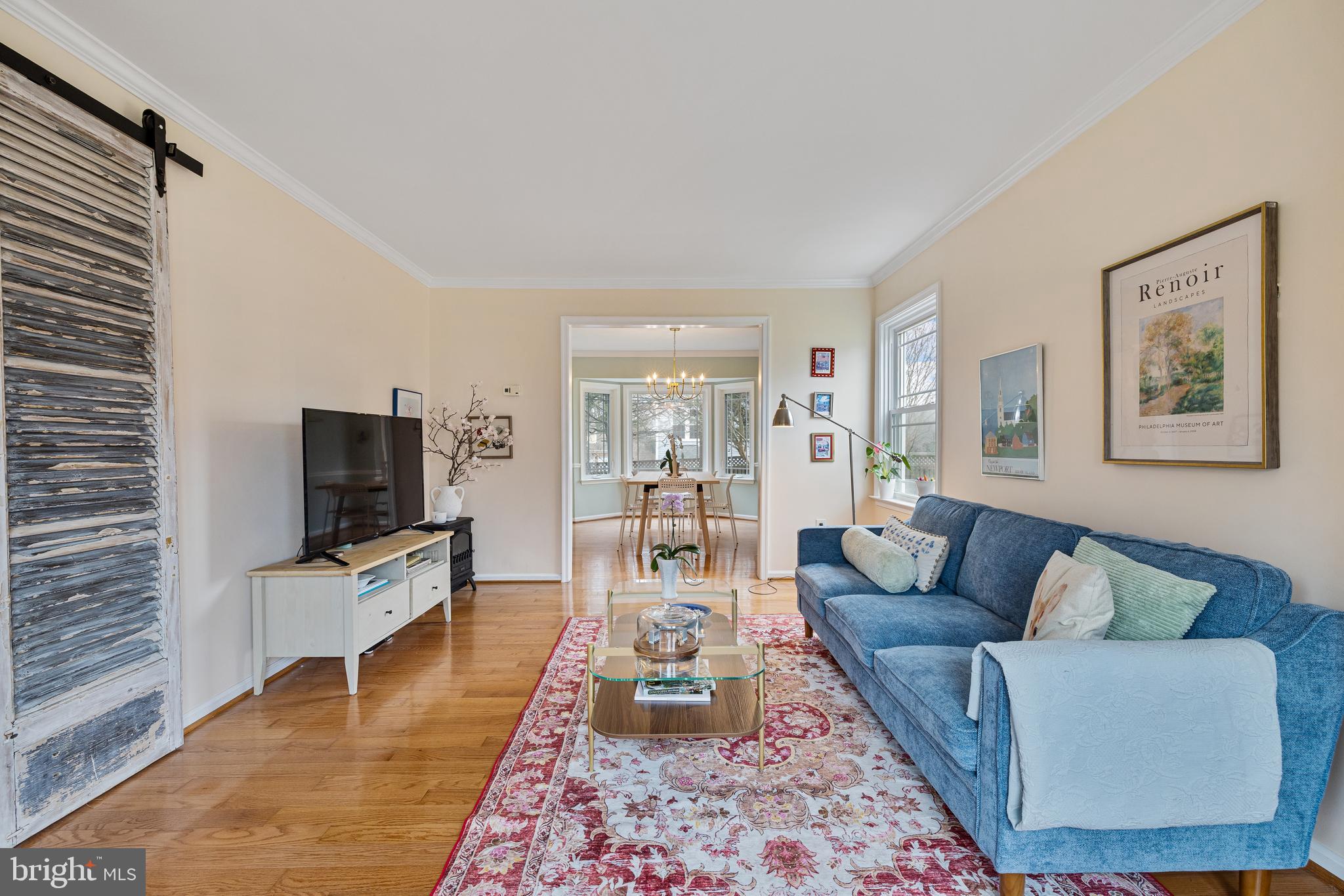 1439 Millikens Bend Road Herndon, VA 20170 - Photo 12 of 46 a living room with furniture wooden floor and a flat screen tv