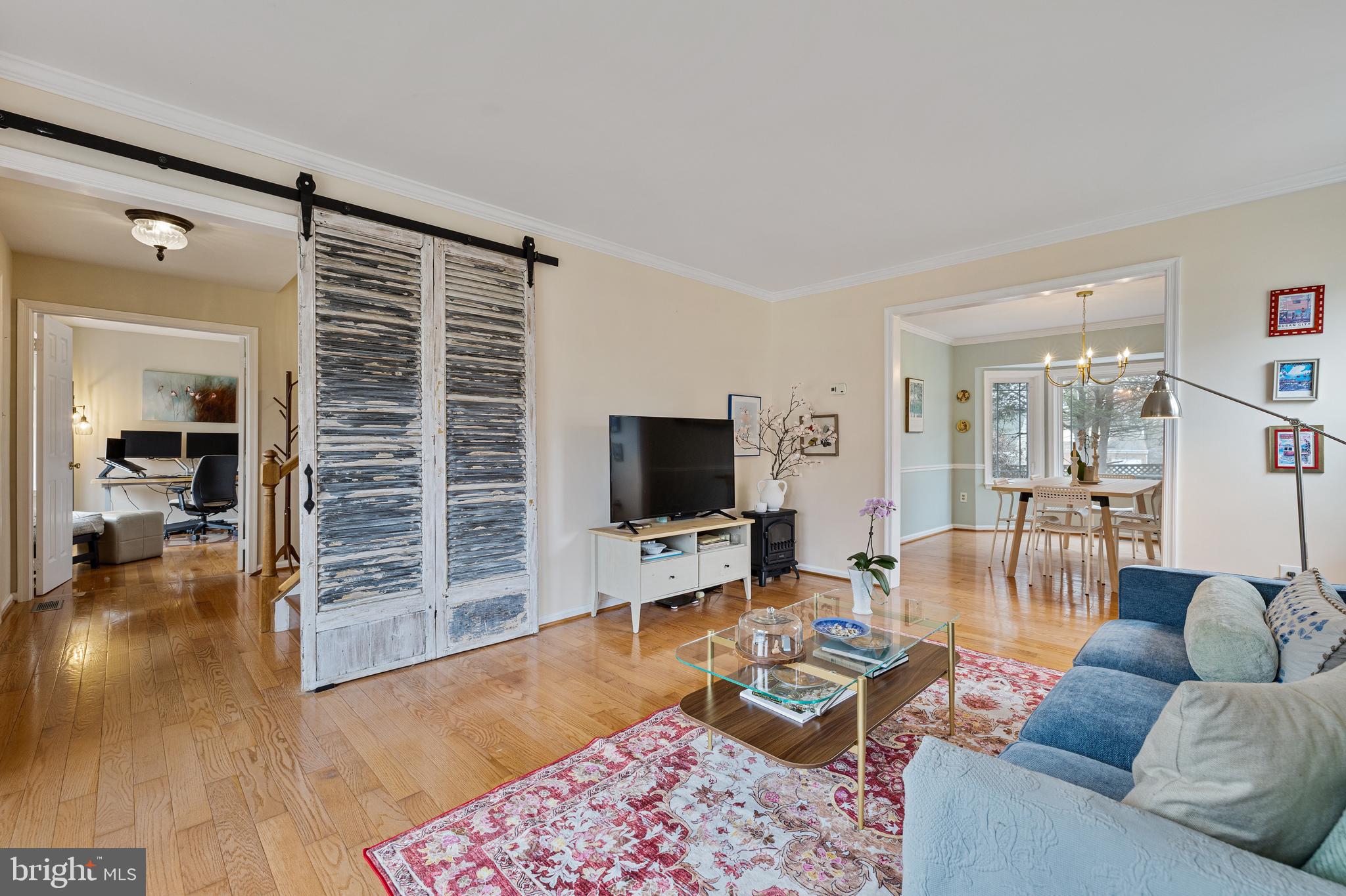 1439 Millikens Bend Road Herndon, VA 20170 - Photo 13 of 46 a living room with furniture and a flat screen tv