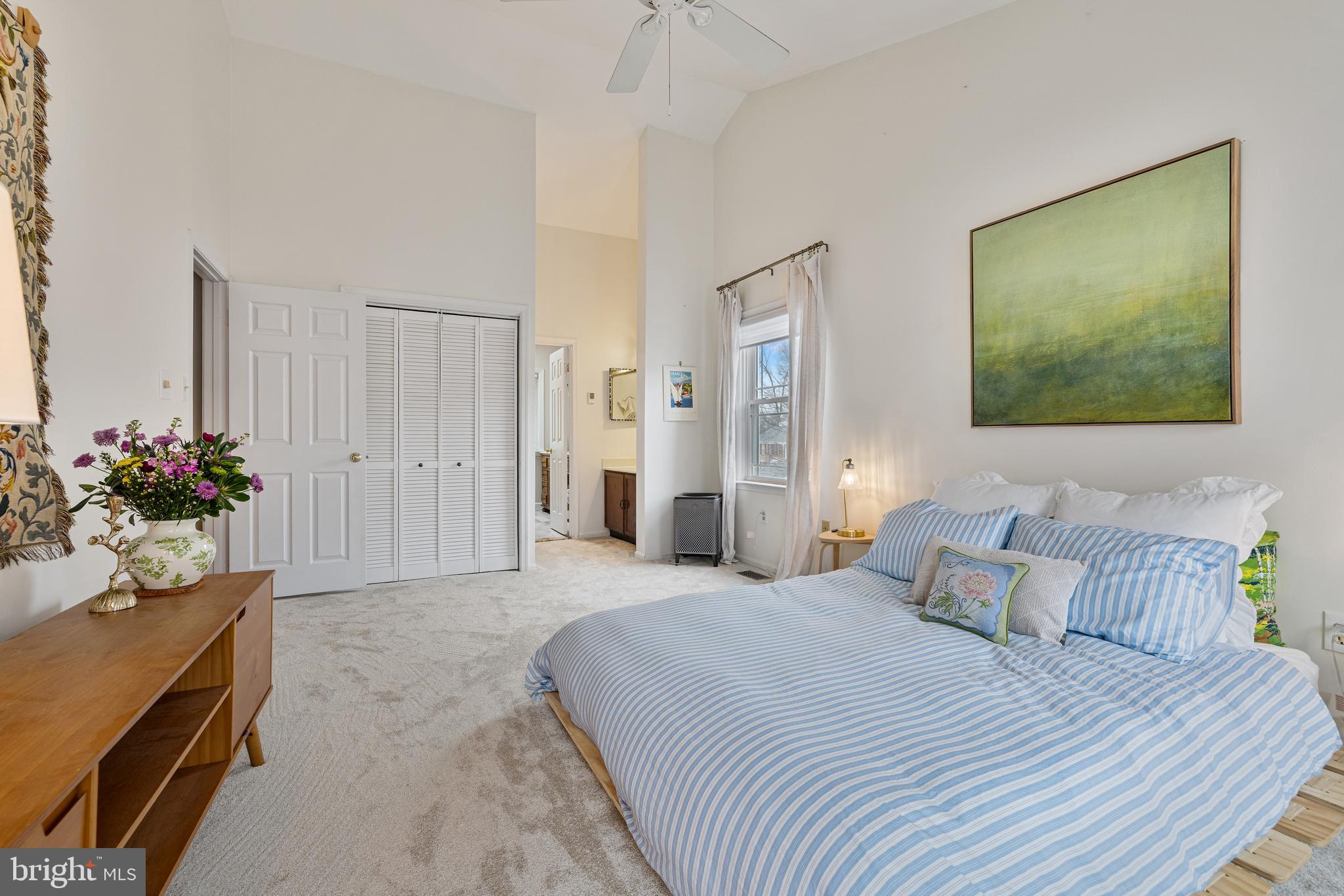 1439 Millikens Bend Road Herndon, VA 20170 - Photo 17 of 46 a bedroom with a bed and a potted plant