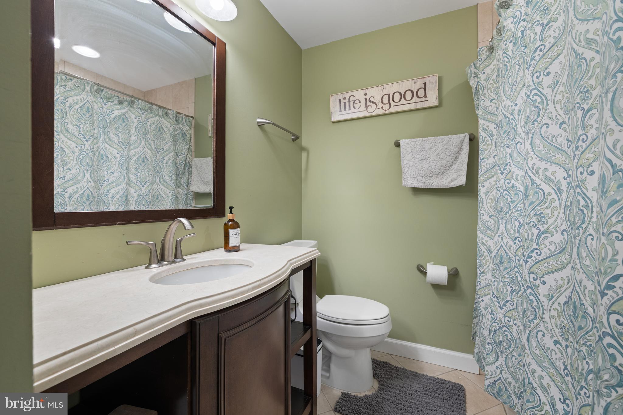 1439 Millikens Bend Road Herndon, VA 20170 - Photo 25 of 46 a bathroom with a sink and a toilet