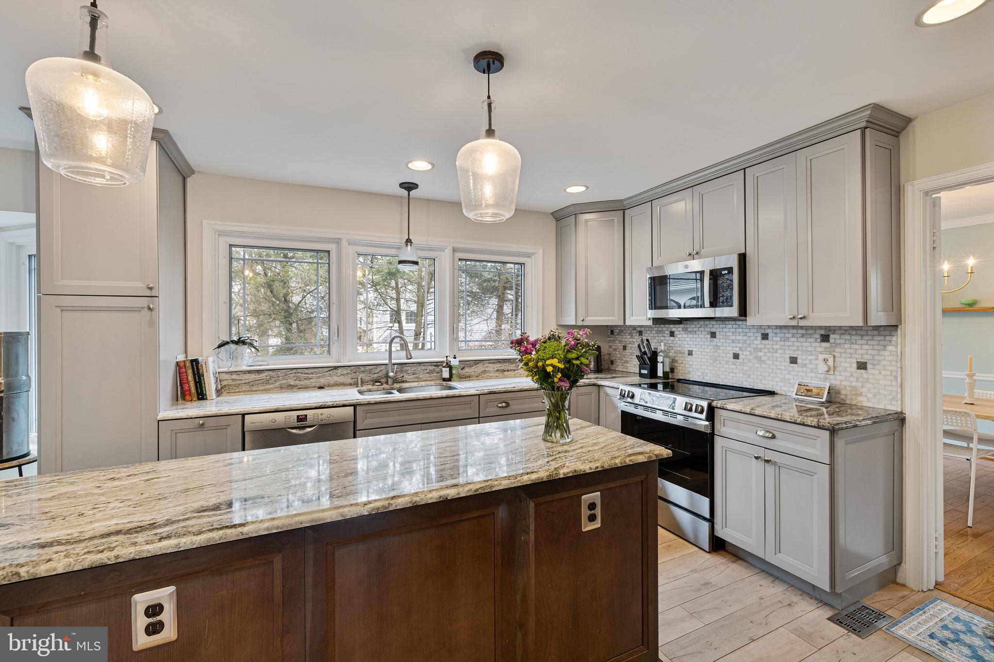 1439 Millikens Bend Road Herndon, VA 20170 - Photo 3 of 46 a kitchen with granite countertop a sink a counter space appliances and cabinets