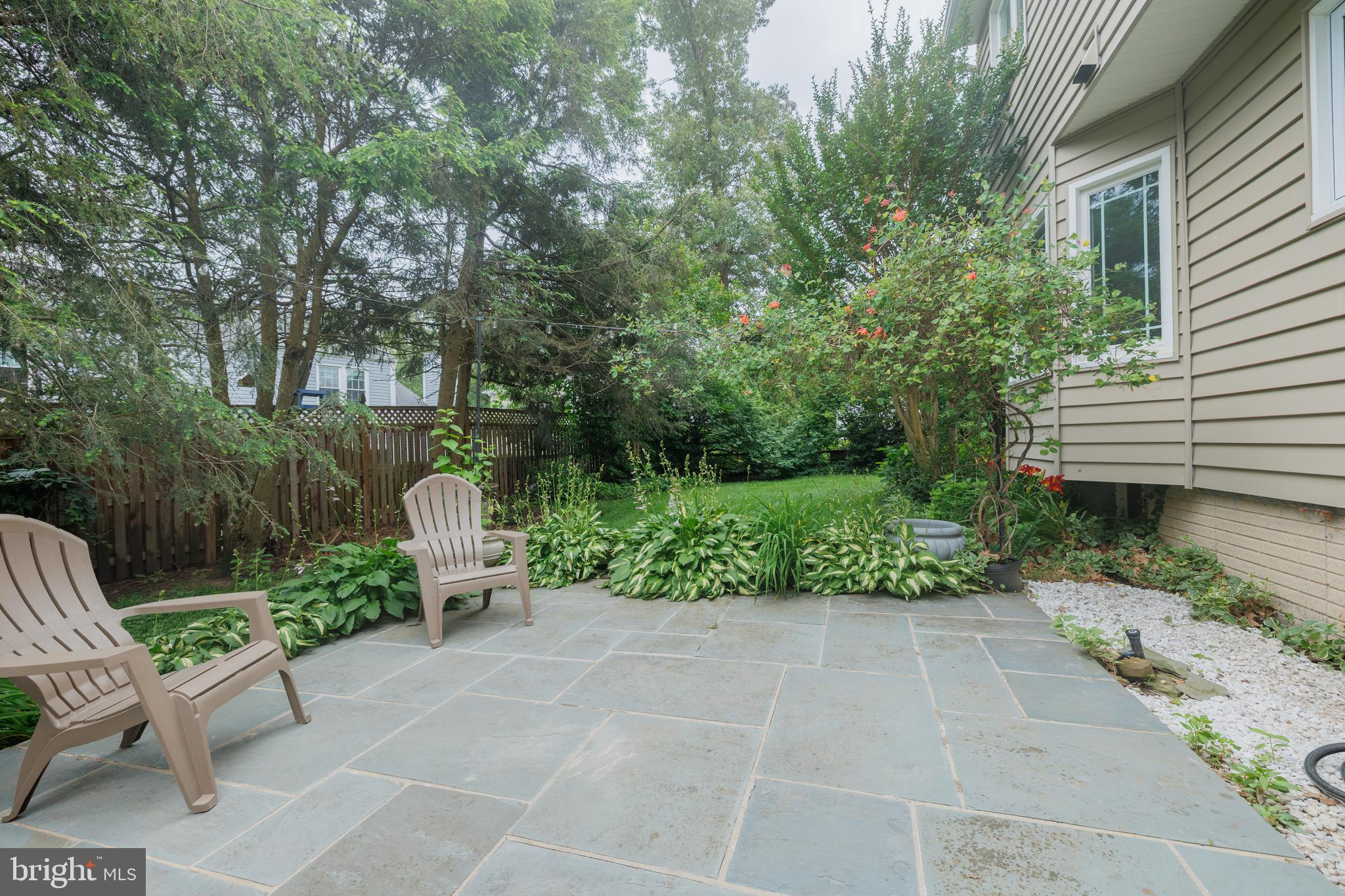 1439 Millikens Bend Road Herndon, VA 20170 - Photo 34 of 46 a view of a garden with chair and tables